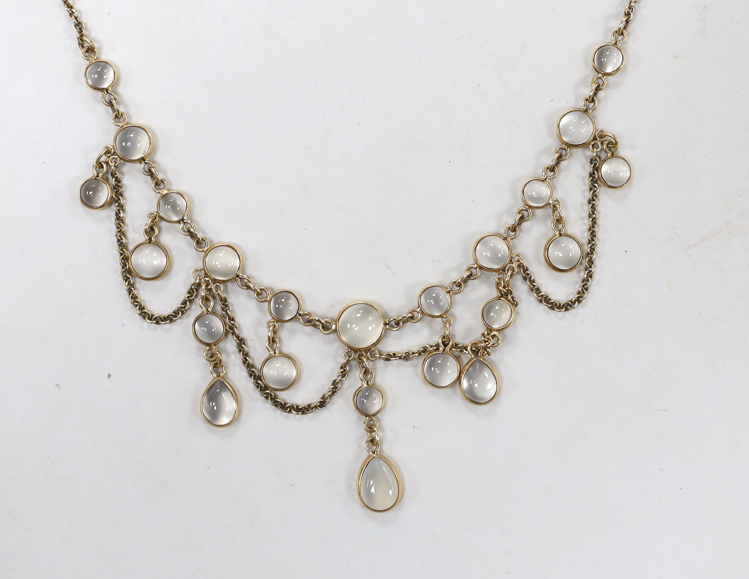 A modern Edwardian style 9ct gold and moonstone cluster set drop fringe necklace, 42cm, gross weight 12.5 grams.